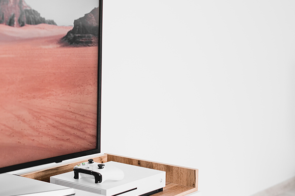 Zirkle Tech can help set up your new television or video game system Gaming console set below large flat screen TV featuring desert landscape